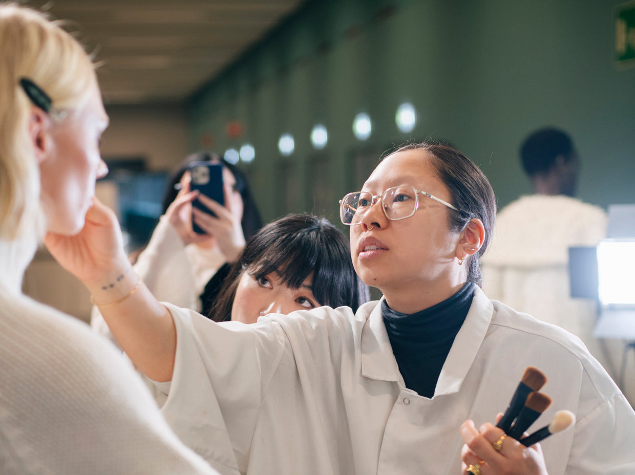 ADDICTION TOKYO Global Creative Director KANAKO TAKASE applying makeup on model